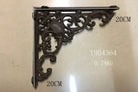 Black cast iron triangle shelf bracket with swirling leaf and scroll pattern