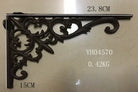 Cast iron right-angle shelf bracket with ornate scroll corner, dark finish