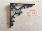 Cast iron right-angle shelf bracket with leaf scroll ornament, dark finish