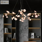 Ceramic flower chandelier with pink-white butterfly blossoms and gold metal ring frame