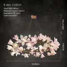 Decorative ceramic flower chandelier with glowing white and pink petals, gold ceiling mount