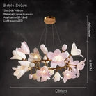 Ceramic flower chandelier with pink and white blossoms, round gold canopy and hanging rods