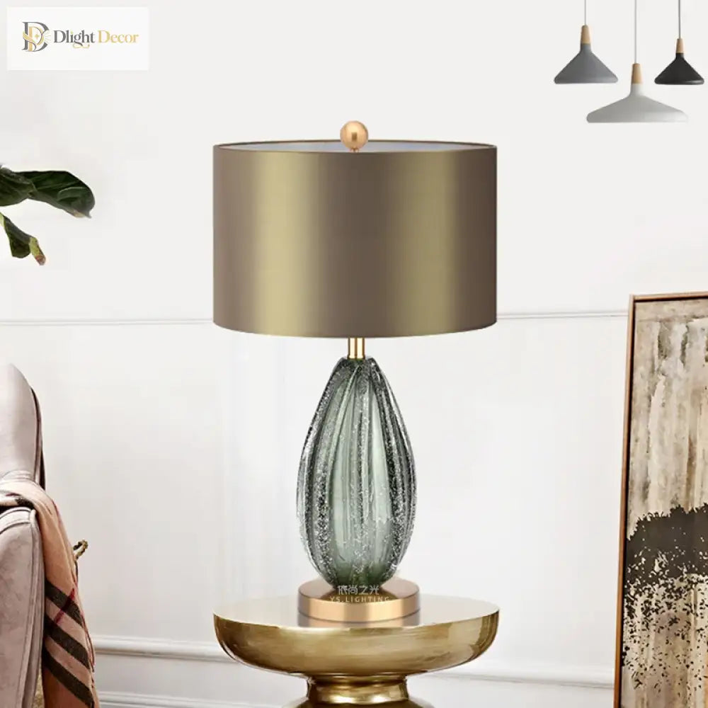 LED desk lamp with green ribbed glass base, beige drum shade, brass pedestal