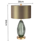 LED desk lamp with green ribbed crystal glass base and beige drum shade, 64cm height