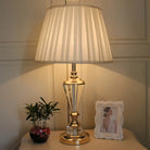 Crystal LED desk lamp with pleated white shade and gold-toned crystal base