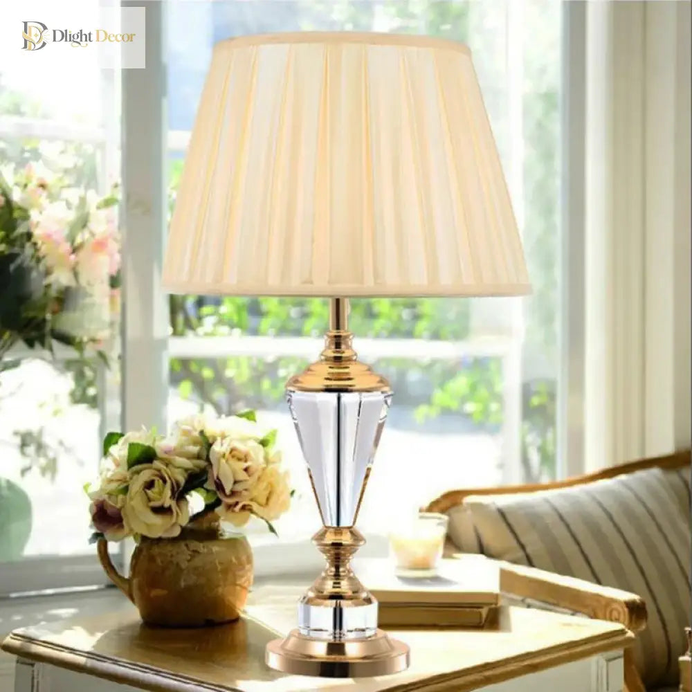 Crystal LED desk lamp with gold base, crystal body, and pleated white shade