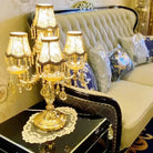 Crystal LED desk lamp with gold stand, multiple fabric shades, and crystal drop accents