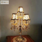 Crystal LED desk lamp with gold metal frame, multi fabric shades, and clear crystal ornaments
