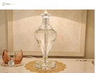 Clear crystal column table lamp with pleated white shade and gold trim