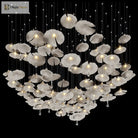 Mushroom-style ceramic chandelier with multiple glowing white shades on long metal cords