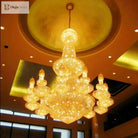 Gold crystal chandelier with glowing center globe and hanging crystal lanterns, multi-tier