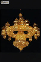Gold crystal chandelier with tiered ring arms and sparkling strands, central pendant