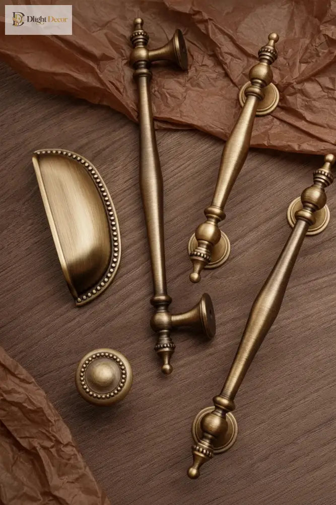 Antique brass cabinet handles with oval escutcheon plates and decorative end caps