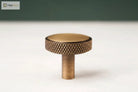 Antique brass round cabinet knob pull with cross-knurled textured rim