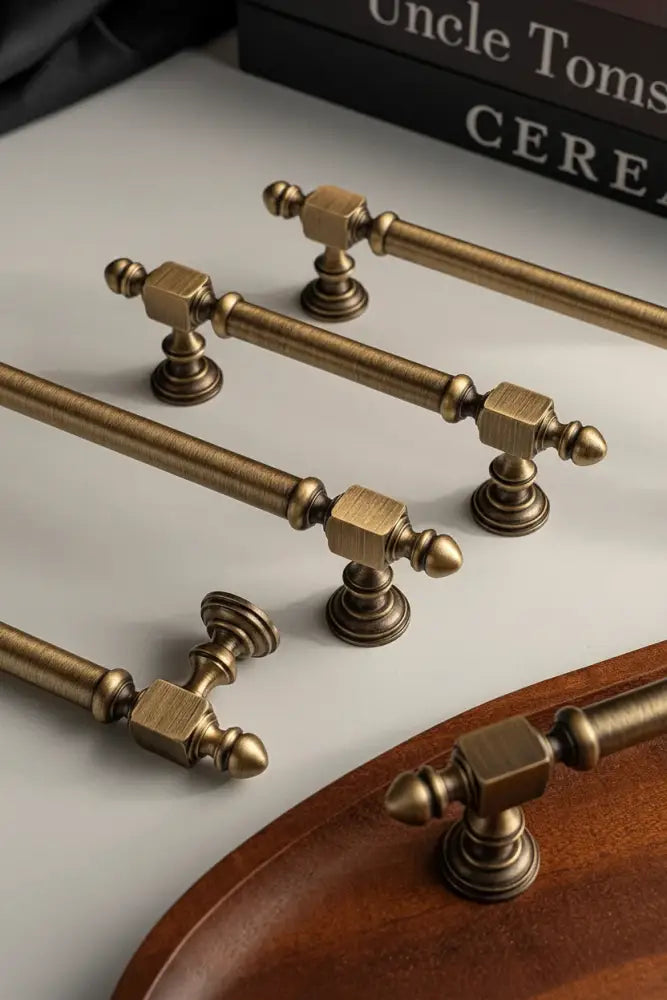 Antique brass hammered cabinet handle set with round pull and decorative finials