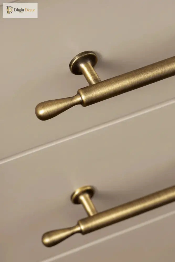 Bronze bar cabinet handle with rounded grip ends and circular backplate mounts