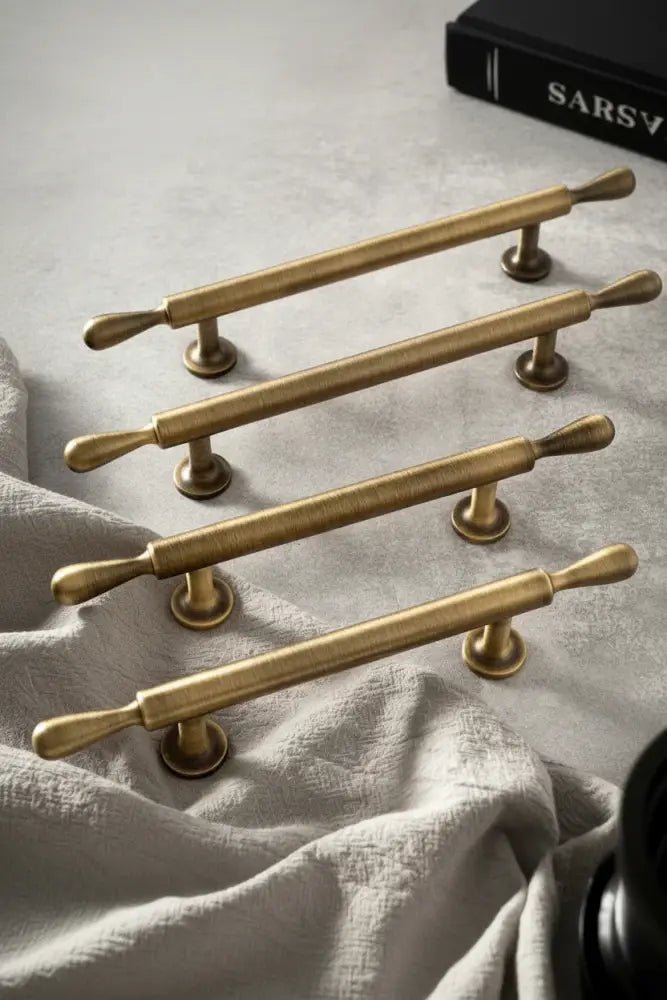 Antique brass bar cabinet handles set with rounded ends and circular mounting bases