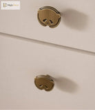 Brushed brass panda cabinet knobs on light cabinet drawers, single-hole round mount