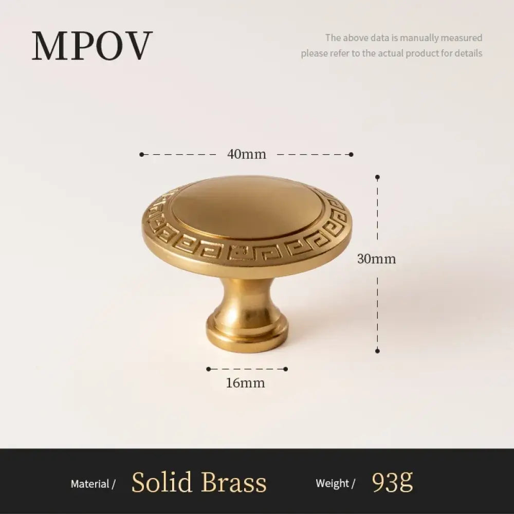 Antique brass cabinet knob with patterned rim and flat domed top, 40mm