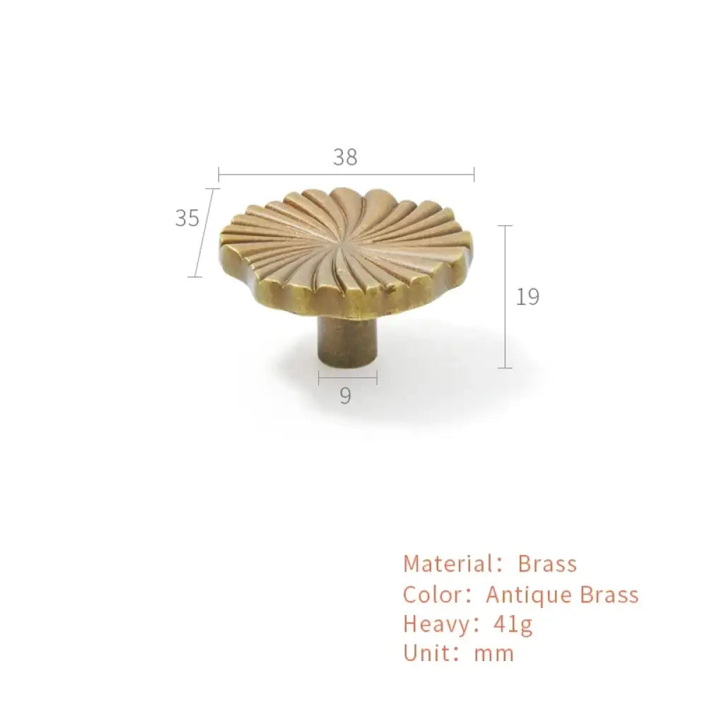 Antique brass ruffled cabinet handle with fan ridges, shown with size measurements.