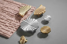 Ruffled cabinet handles in bright silver, PVD gold, and antique brass finishes (multi-pack).