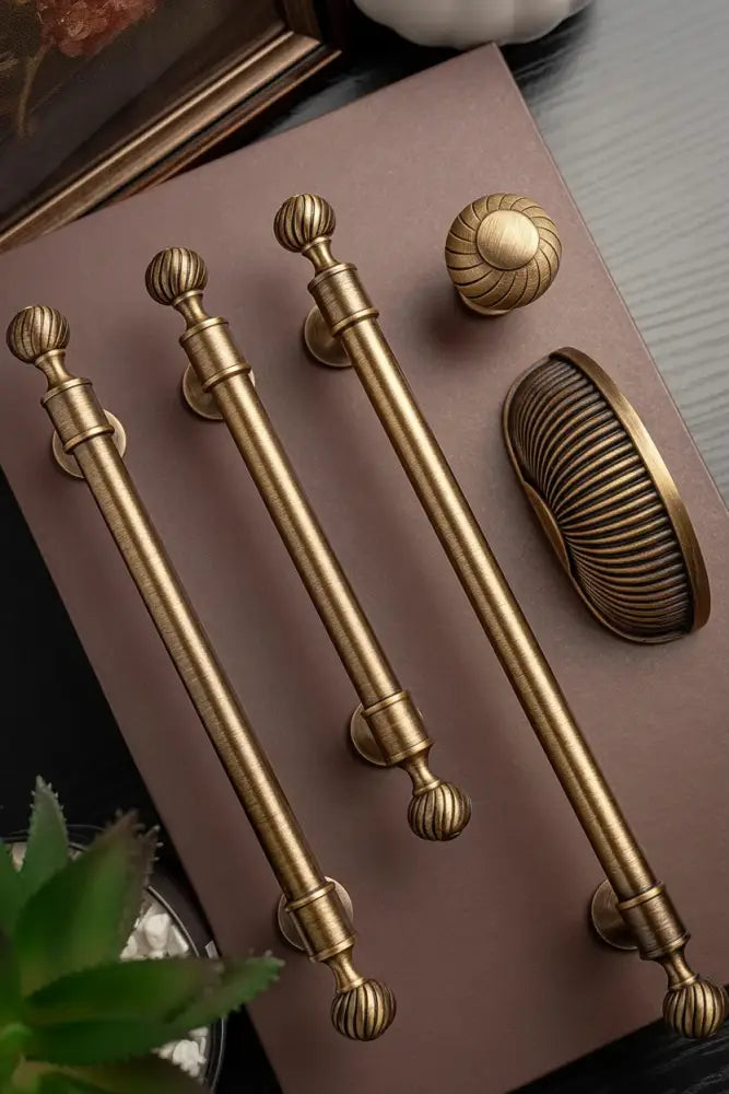 Brushed brass cabinet pull handle with ribbed knob end caps