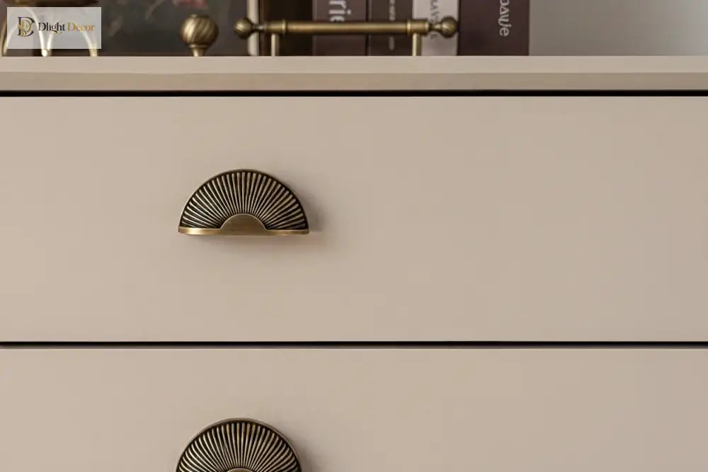 Brushed brass half-moon drawer pull with ribbed shell design