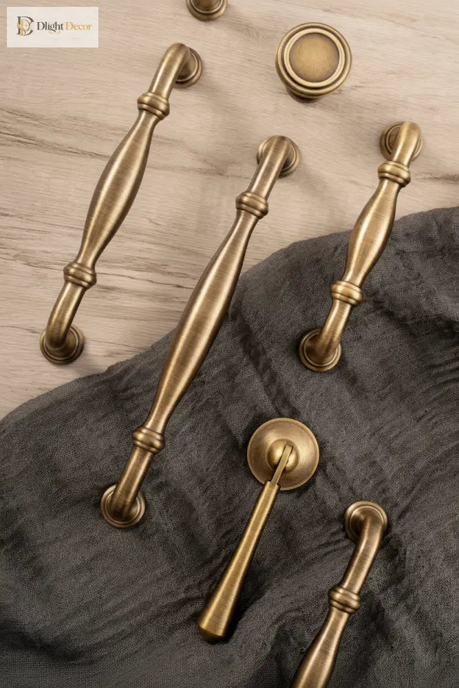 Antique brass cabinet hardware set with T-bar pulls and round knobs