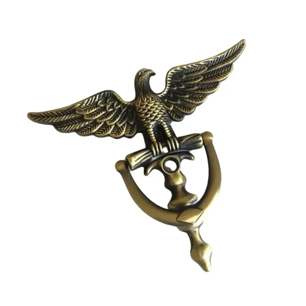 Gold-toned eagle head door knocker with detailed wings and arched mounting handle