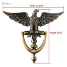 Eagle head door knocker, bronze-toned finish with arched handle and wing details