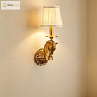 Decorative wall sconce with copper horse-head design and beige fabric drum shade