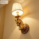 Decorative copper wall light with horse head relief and beige drum fabric shade