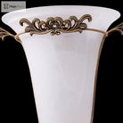 Ornate gold wall sconce with frosted glass shade, front view