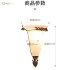 Gold retro wall sconce with frosted glass shade and floral metal finial