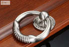 Polished chrome round door knocker with coiled handhold and circular base