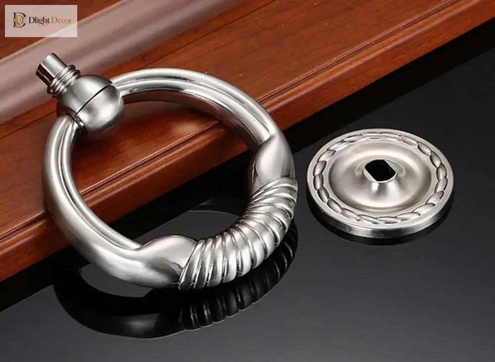 Satin nickel round door knocker with coiled ring grip and round mounting plate