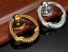 Brushed chrome round door knocker with coiled ring and circular backplate