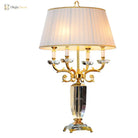 Fabric LED table lamp with pleated cream fabric shade and gold-and-clear candelabra stand