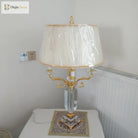 Fabric LED table lamp with pleated cream shade (plastic cover) and gold arms, clear base