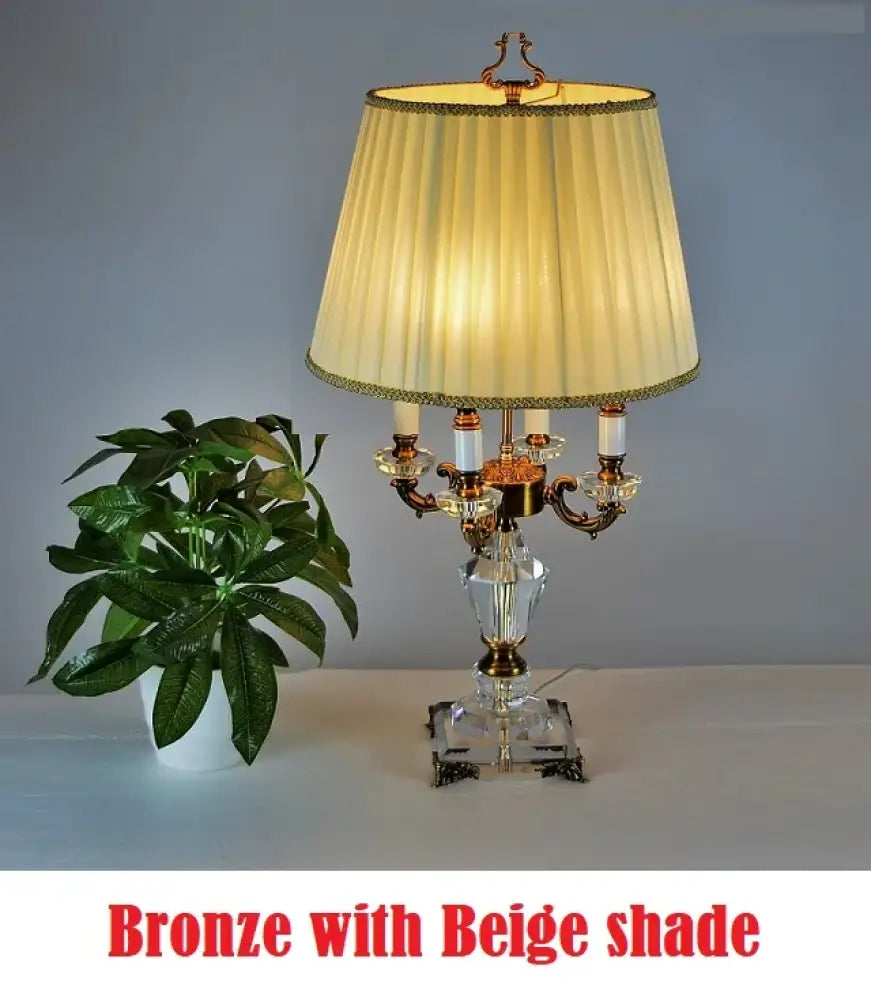 Bronze-tone fabric LED desk lamp with beige shade and crystal base