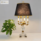 Modern fabric LED desk lamp with black fabric shade and gold-tone base