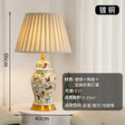Floral ceramic desk lamp with pleated shade and gold base; 66 cm tall, 40 cm wide.