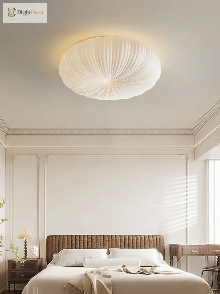 Cream flush-mount ceiling light with ribbed fabric dome shade