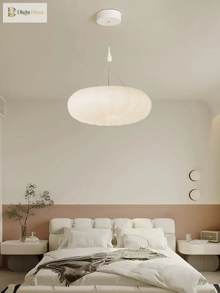 Cream fabric pendant ceiling light with ribbed globe shade and hanging cord