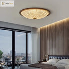Walnut flush-mount ceiling light with clear ribbed acrylic diffuser and warm glow