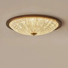 Walnut round flush-mount ceiling light with faceted clear acrylic globe diffuser