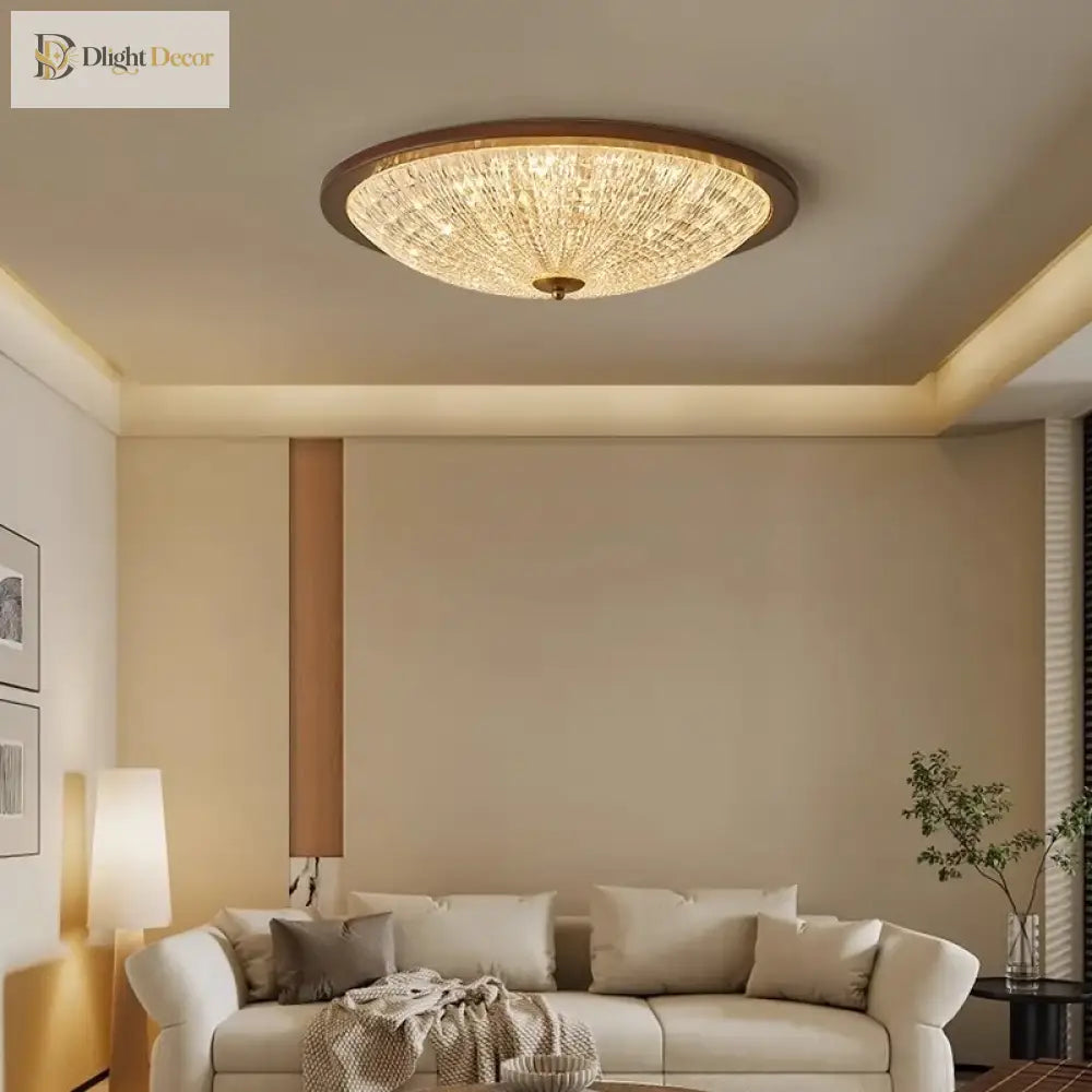 Walnut flush-mount ceiling light with clear ribbed acrylic diffuser above a sofa
