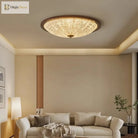 Walnut flush-mount ceiling light with clear ribbed acrylic diffuser above a sofa