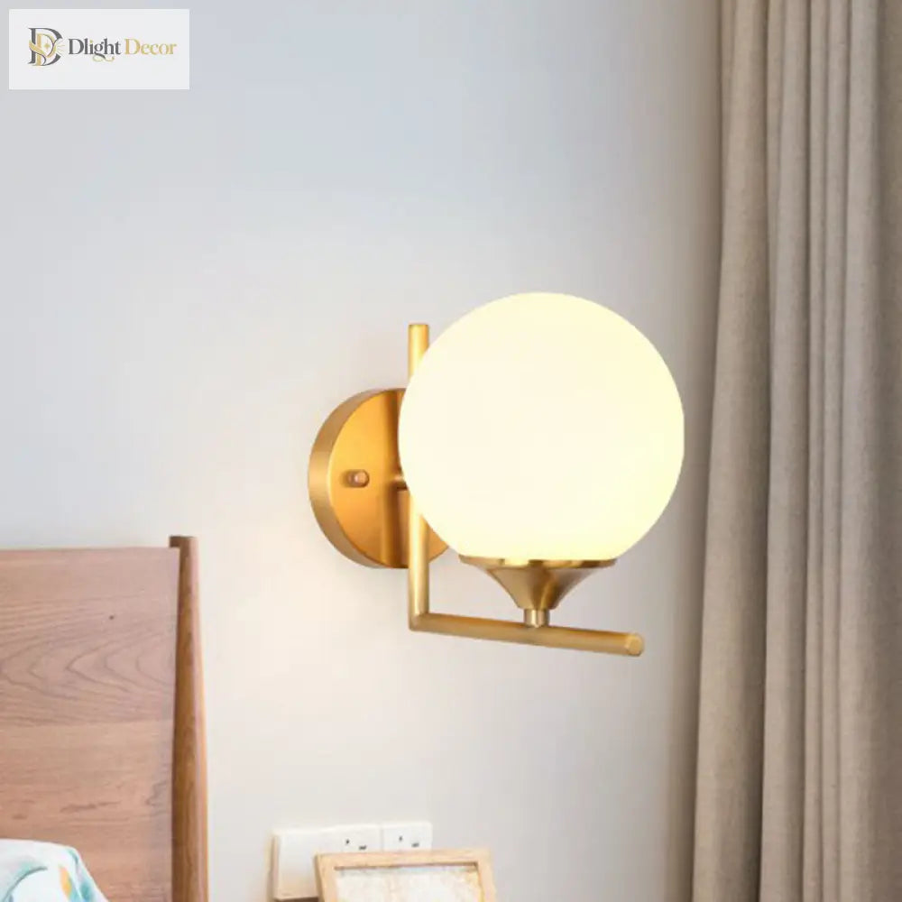 Modern Elegance Meets Warmth: Gold Sphere Bedside Wall Sconce