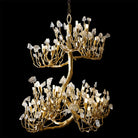Hanging crystal chandelier with gold-toned tree-branch design and clear crystal prisms